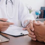 healthcare professional discussing affordable care act vs obamacare